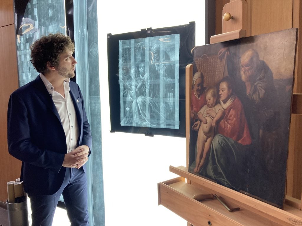 Art historian Constantin Pion observes an x-ray of Jacob Jordaens's The Holy Family (1612–13). Image courtesy Musées royaux des Beaux-Arts de Belgique.