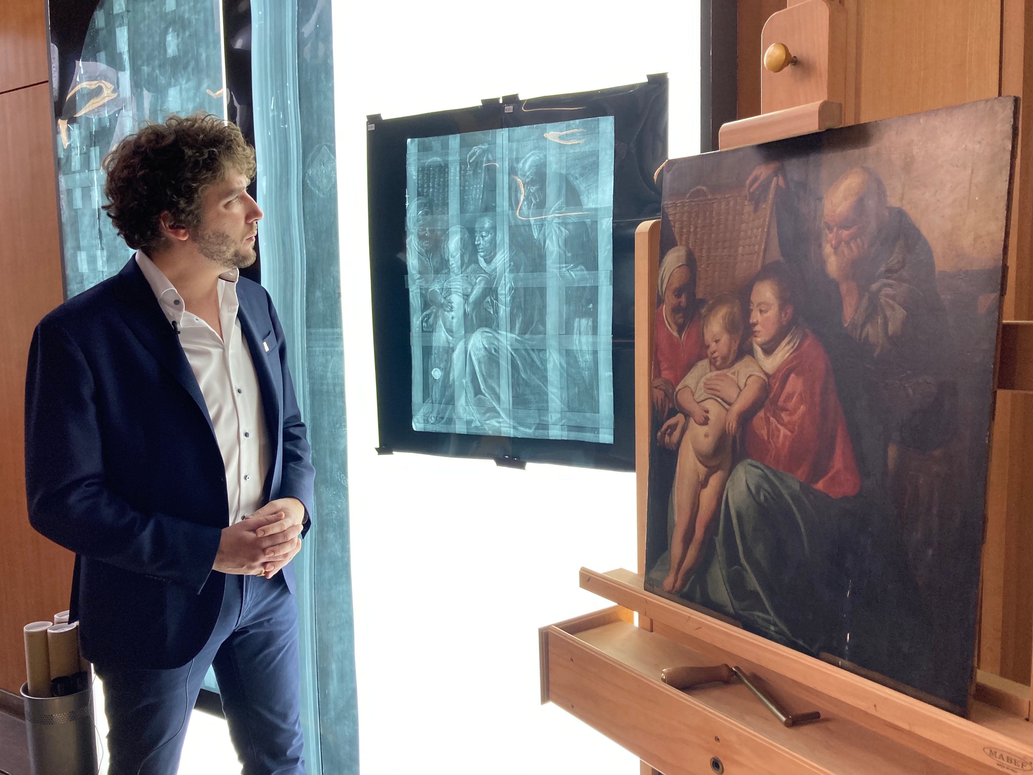 Art historian Constantin Pion observes an x-ray of Jacob Jordaens's The Holy Family (1612–13). Image courtesy Musées royaux des Beaux-Arts de Belgique.