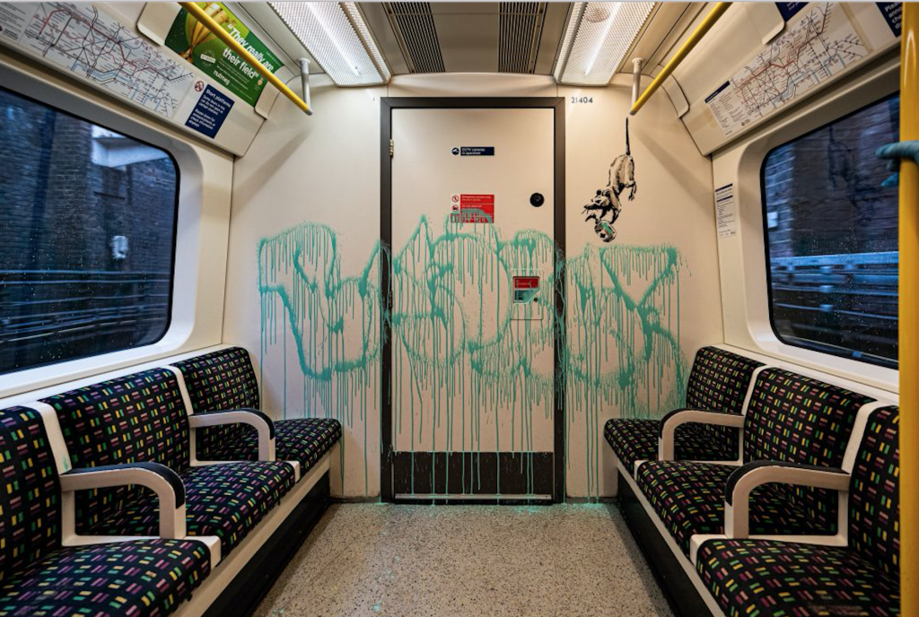 A still from a video Banksy posted of his artwork inside a London tube car. Courtesy Banksy.