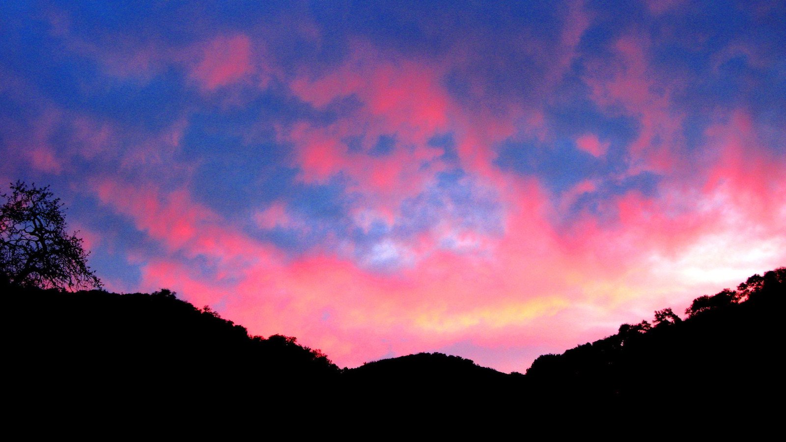 Sunset over Atascadero, California, where a less-mysterious monolith than the one that arose in the desert of Utah has now appeared on Pine Mountain. Photo by Victor Solanoy, via Flickr.