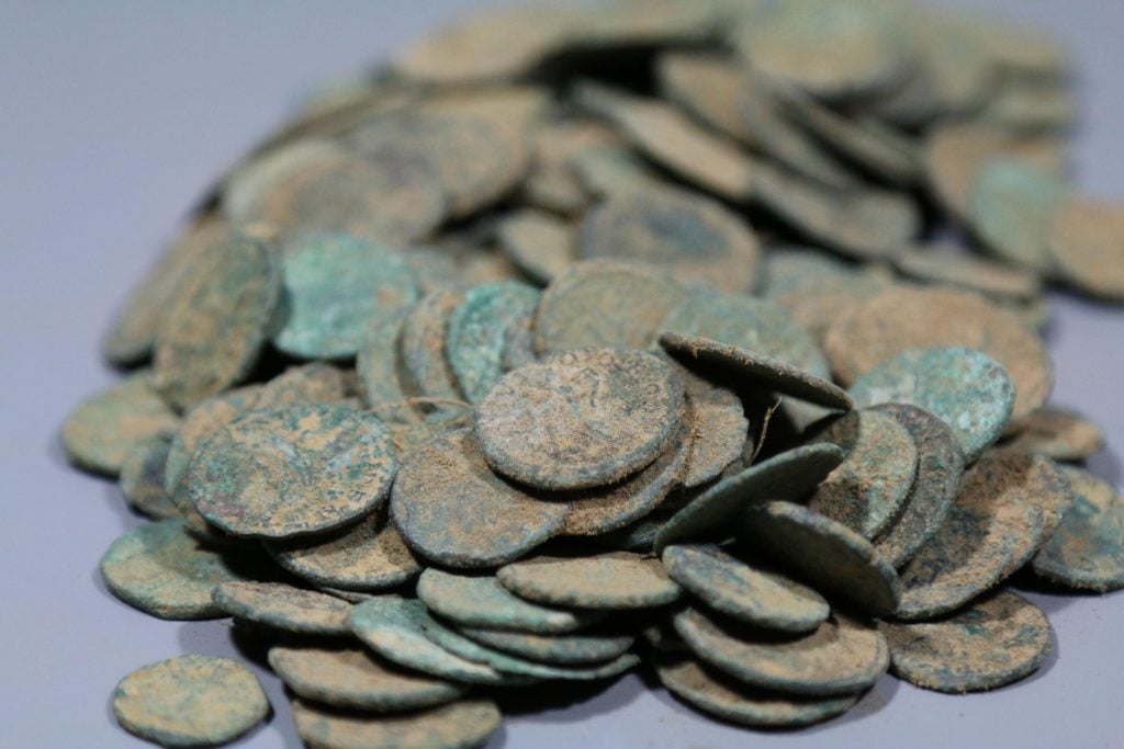 Roman coins supposedly discovered in Belgium are believed to have been illegally excavated in France. Photo courtesy of the Onroerend Erfgoed, the Flemish Organization for Immovable Heritage.