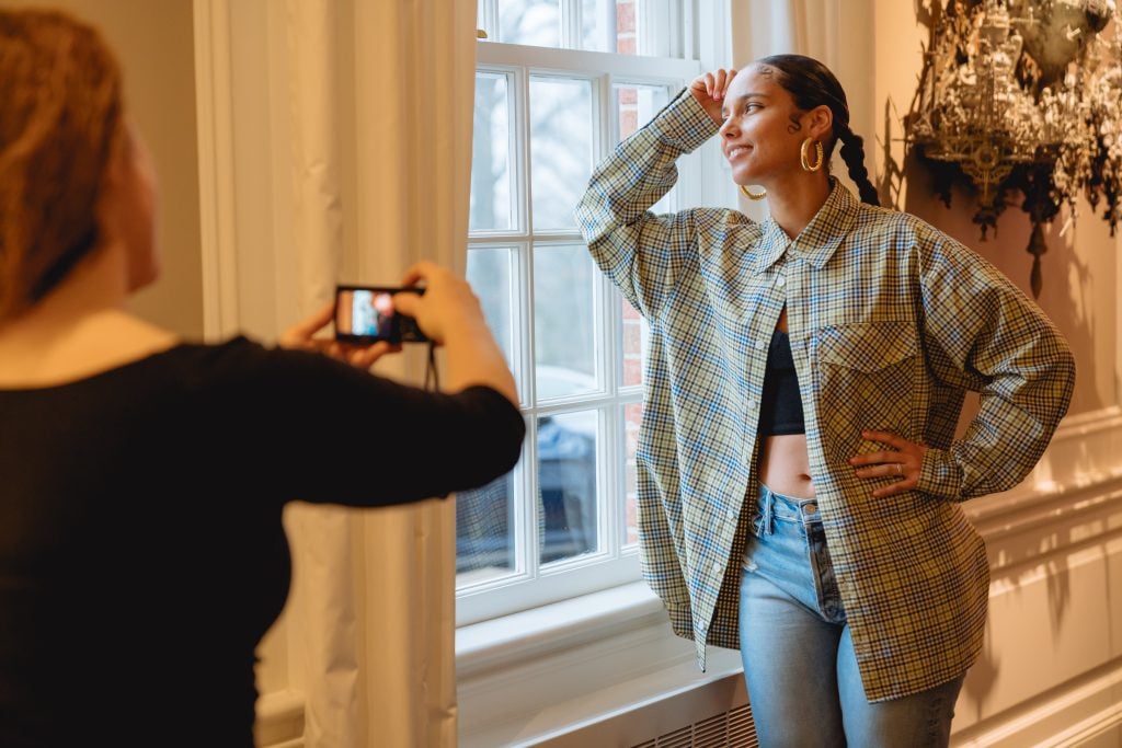 Swoon photographing Alicia Keys. Photo by Roman Rivas.