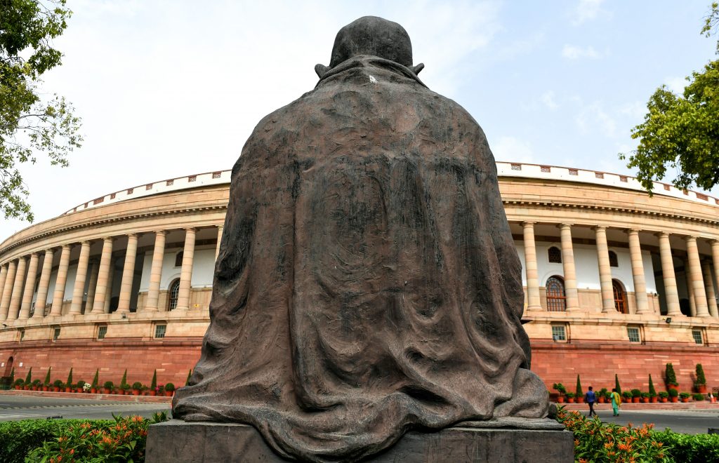 A general view of the Indian Parliament building before the beginning of the first session of the Indian parliament in New Delhi on June 17, 2019. (Photo by Money SHARMA / AFP via Getty Images.)