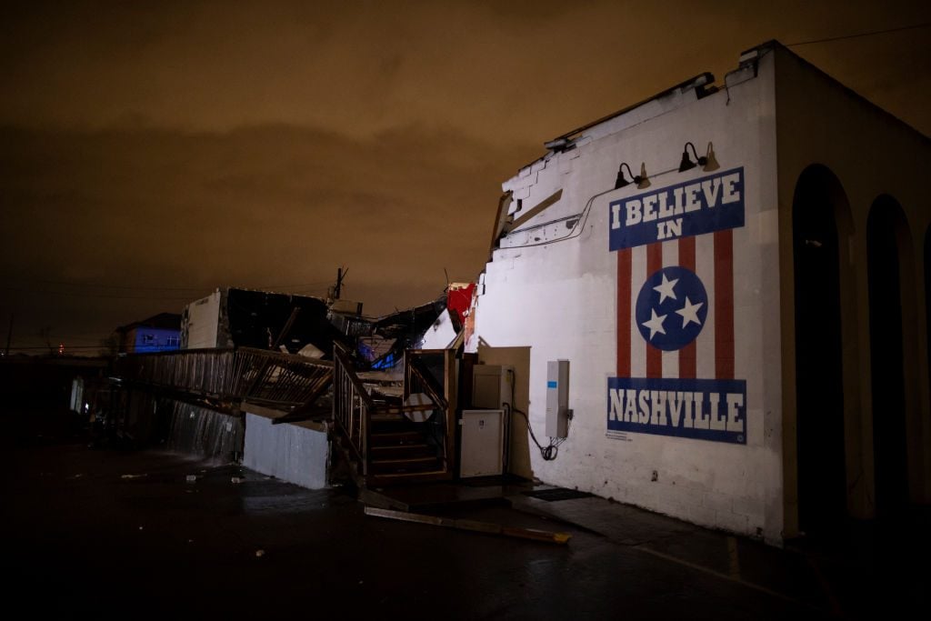 A mural on heavily damaged The Basement East in the East Nashville neighborhood on March 3, 2020 in Nashville, Tennessee after a tornado passed through—one of a series of disasters to hit the city last year. (Photo by Brett Carlsen/Getty Images)