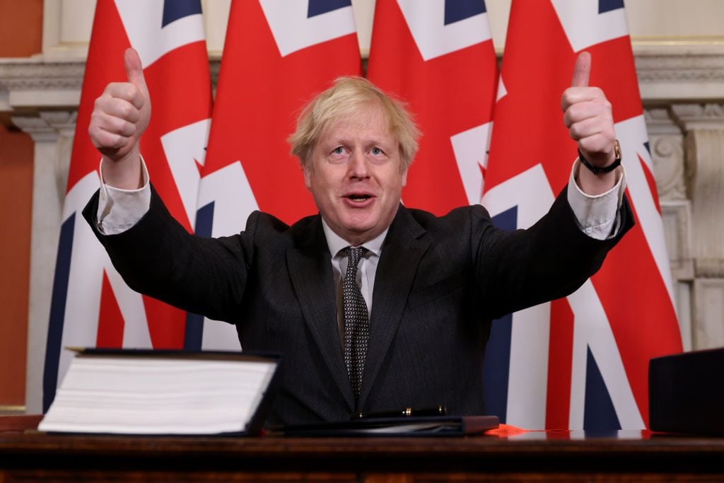 UK Prime Minister Boris Johnson gestures after signing the Brexit Trade Deal with the EU in 10 Downing Street in London, United Kingdom on December 30, 2020. Photo: Pippa Fowles/No10 Downing Street/Handout/Anadolu Agency via Getty Images.