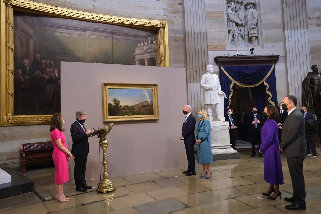 US President Joe Biden and First Lady Jill Biden are presented with a painting from US Senator Roy Blunt. January 20, 2021 in Washington, DC. (Photo by WIN MCNAMEE/POOL/AFP via Getty Images)