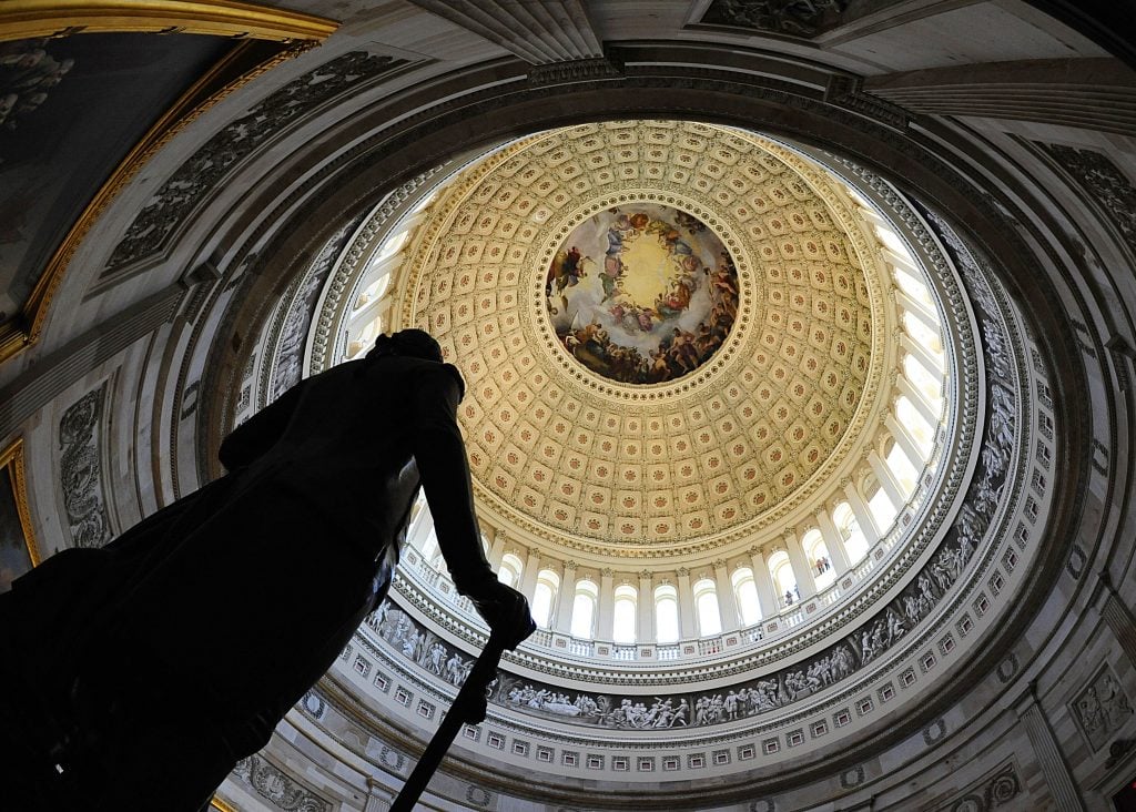 The statue of George Washington in the rotunda of the US Capitol on April 16, 2009 in Washington, DC. (Photo by KAREN BLEIER/AFP via Getty Images)