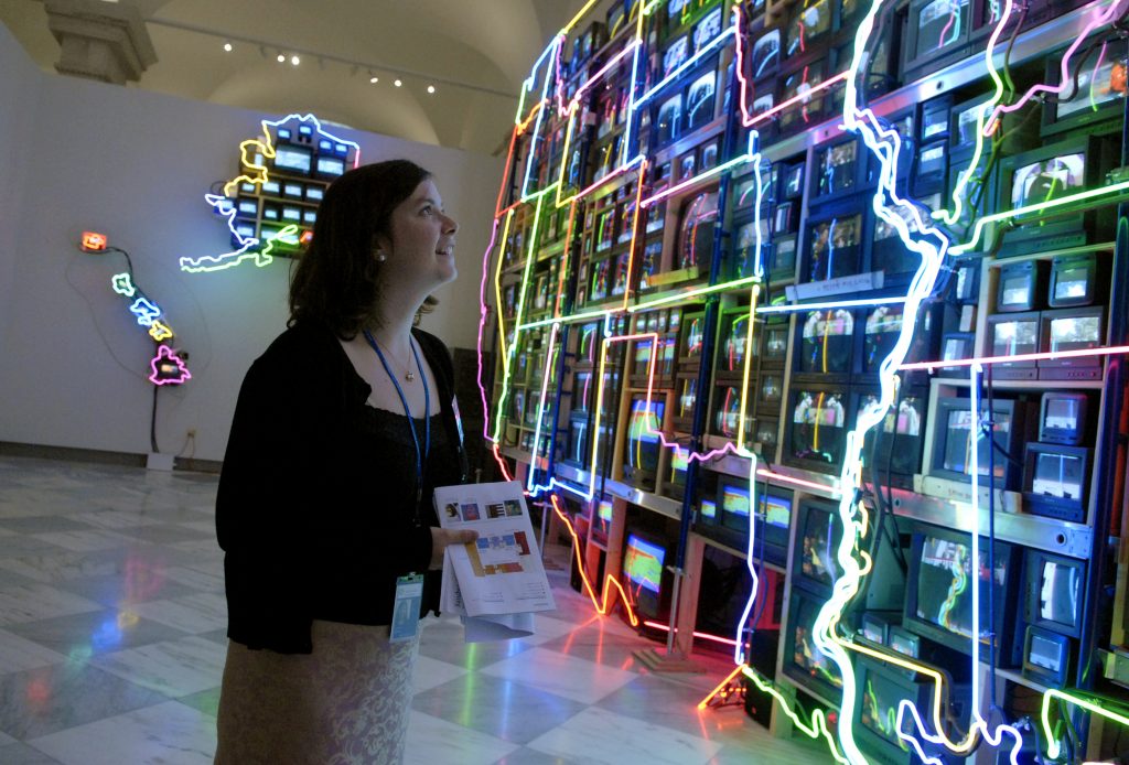 Intern Caroline Barker views a neon map of America by Nam June Paik, in the Smithsonian American Art Museum and National Portrait Gallery. (Photo By Tom Williams/Roll Call/Getty Images)