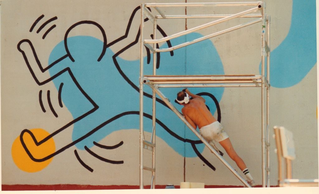 Keith Haring paints a mural at Clarkson St. and Seventh Ave. in Manhattan, August 20, 1987. Photo by Mark Hinjosa/Newsday RM via Getty Images.