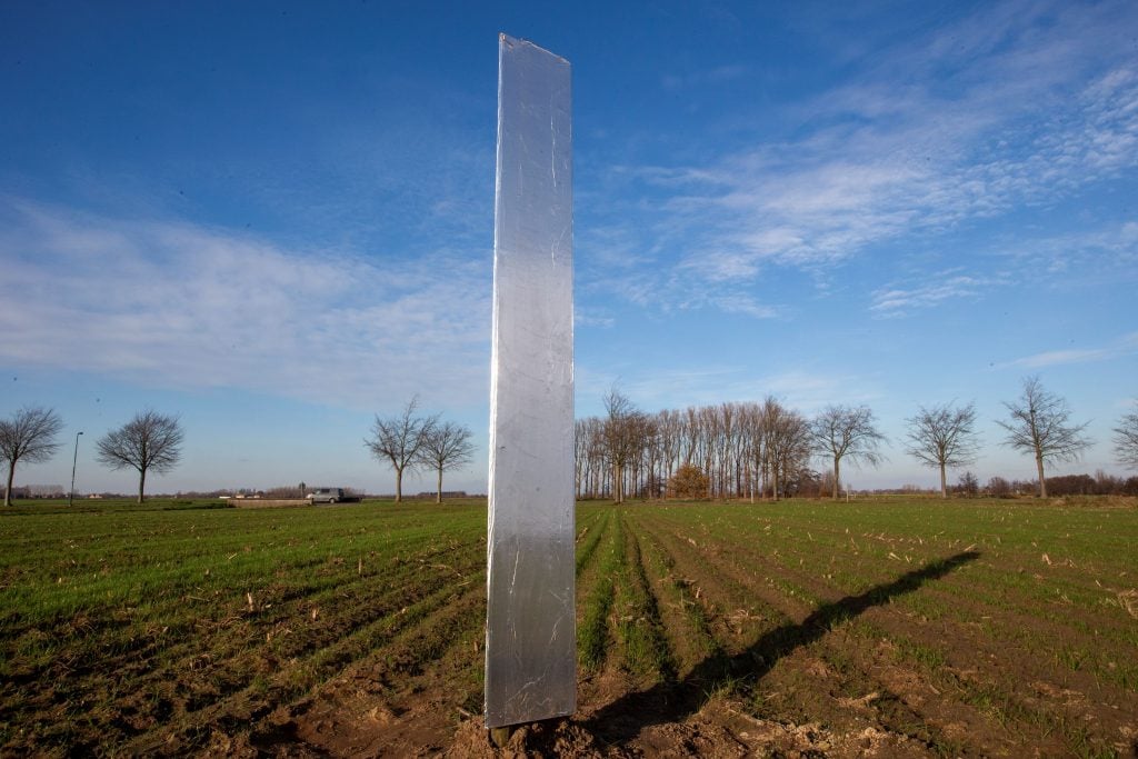 A metal monolith was discovered in a field in Assenede, Belgium on December 10, 2020. Photo by Nicolas Maeterlinck/Belga/AFP via Getty Images.