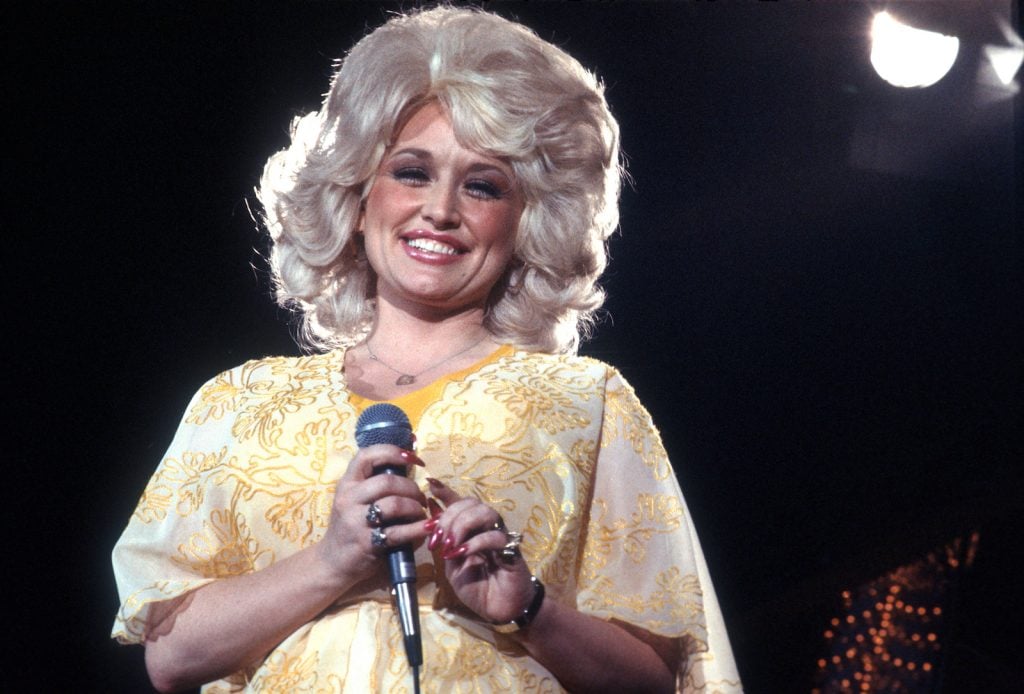 Dolly Parton performs, circa 1975, Los Angeles, California. Photo by Michael Ochs Archives/Getty Images.