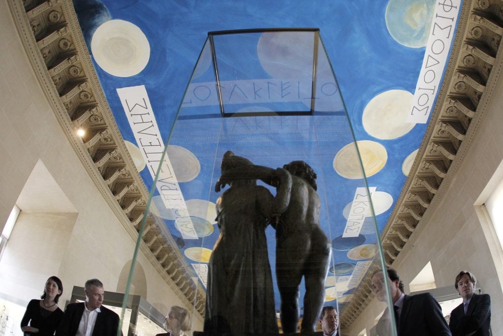 A picture taken on March 23, 2010 in Paris, shows a painted ceiling by American painter Cy Twombly at the Salle des Bronzes, one of the oldest sections of the Louvre museum. Photo: Francois Guillot/AFP via Getty Images.