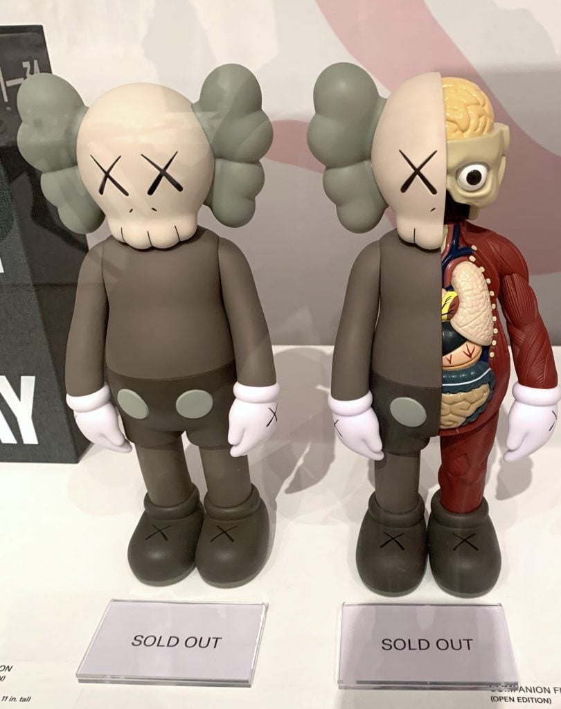 Figurines for sale in the gift shop for "KAWS: What Party" at Brooklyn Museum, already sold out. (Photo by Ben Davis)