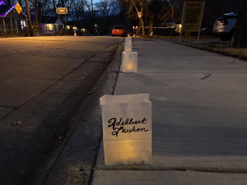 One of the paper lanterns in Sonia Gutiérrez's art installation Luminarias on S. Washington Ave. , featuring the name of Adelbert Laukon, who died from COVID-19. Photo by Sonia Gutiérrez.