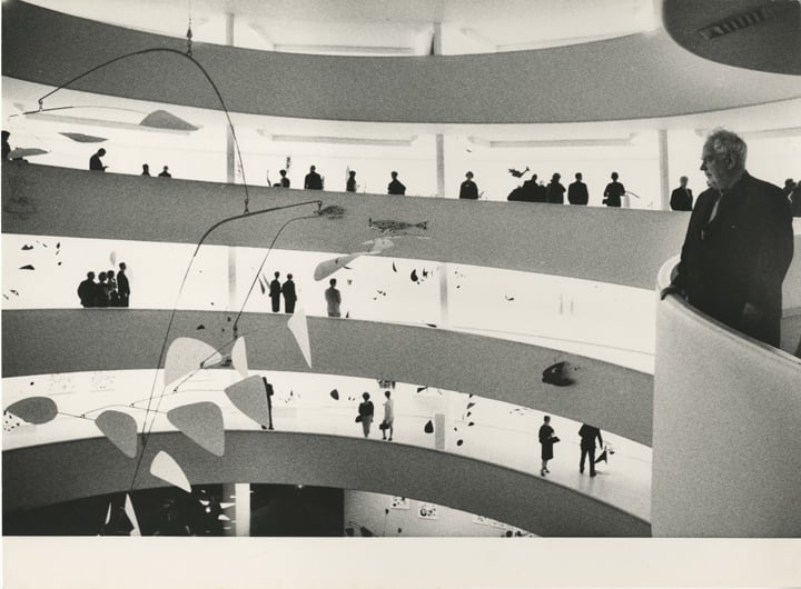 Calder at the opening preview for "Alexander Calder: A Retrospective Exhibition," Solomon R. Guggenheim Museum, New York, 1964. Photograph: Ugo Mulas © Ugo Mulas Heirs. © 2021 Calder Foundation, New York / Artists Rights Society (ARS), New York.