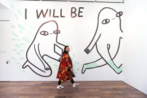 Artist Chanel Miller with her mural, I was, I am, I will be installation 2020 ©Asian Art Museum.