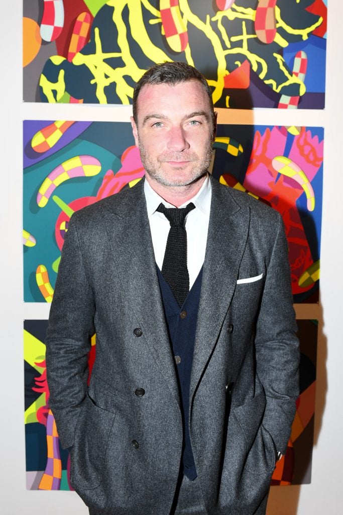 Liev Schreiber with work by KAWS at the New York Academy of Art's Tribeca Ball. Photo courtesy of BFA.