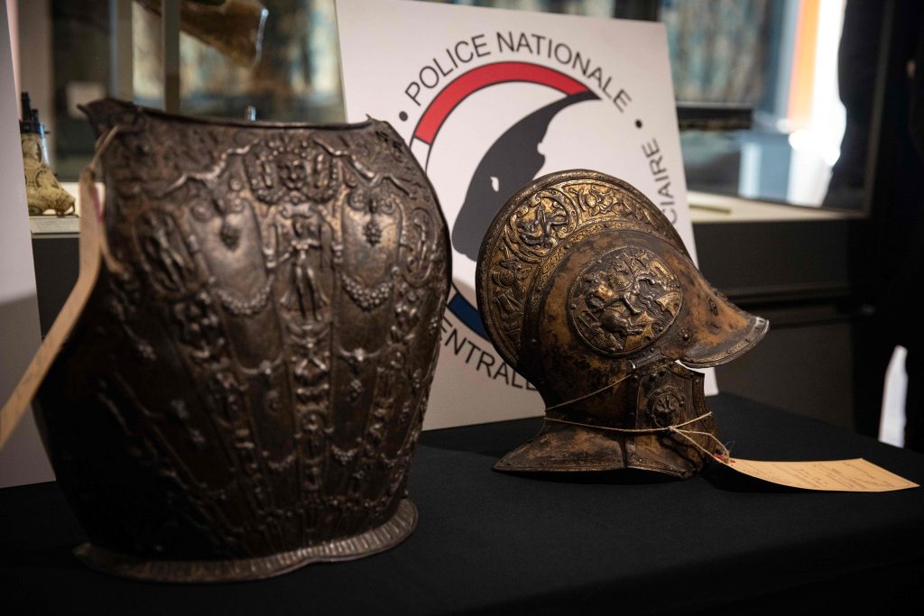 A breastplate and a ceremonial helmet returned to the Louvre by the French Central Directorate of the Judicial Police (DCPJ). (Photo by THOMAS SAMSON/AFP via Getty Images)