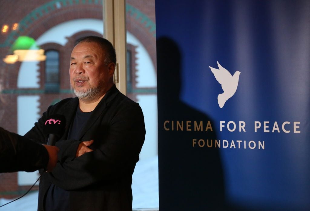 Chinese dissident artist Ai Weiwei attends the announcement of a project for an artistic monument in honor of the final Soviet leader, Mikhail Gorbachev, at Borchardt Restaurant in Berlin, Germany. Photo by Adam Berry/Getty Images.