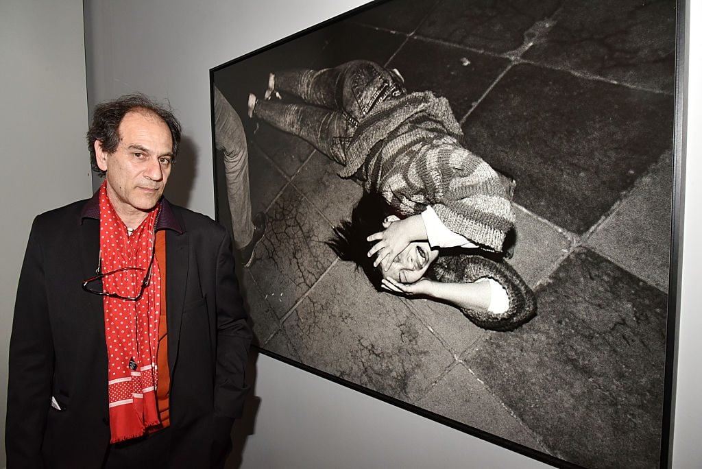 Photographer Patrick Zachmann poses with his work from 'So Long China 1982-2015' at Maison Europeenne de la La Photo in Paris on April 5, 2015 in Paris. Photo by Foc Kan/WireImage.