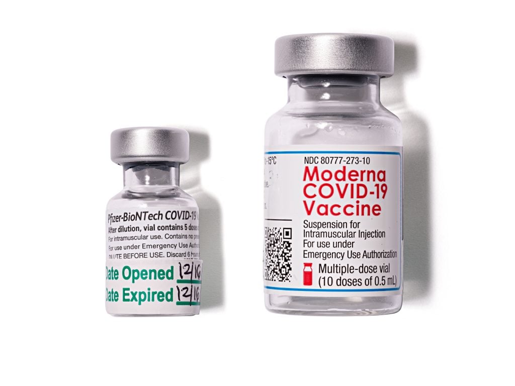 Empty vials of Pfizer Inc’s Pfizer-BioNTech COVID-19 vaccine and ModernaTX, Inc.'s Moderna COVID-19 vaccines