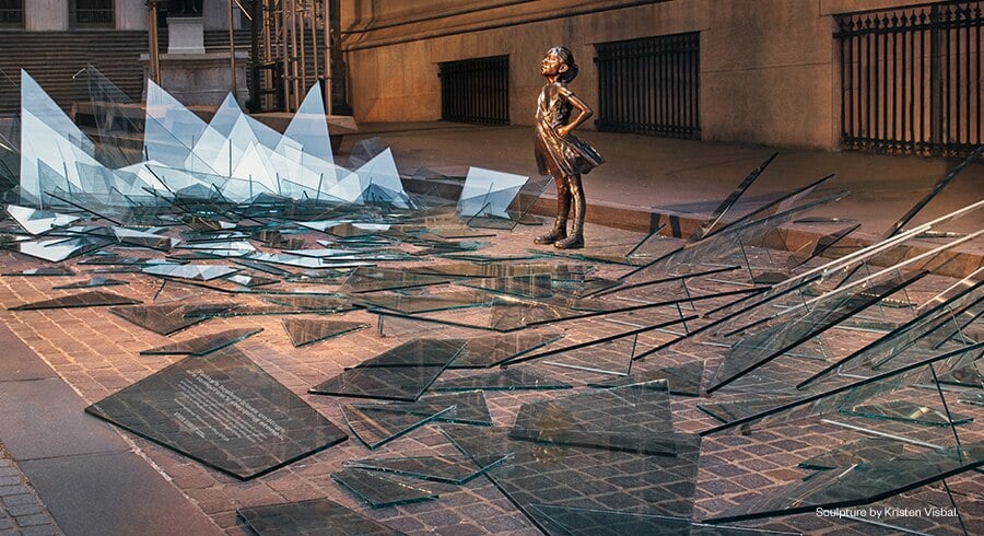 State Street Global Advisors has revisited its famous Fearless Girl artwork, surrounding the statue by Kristen Visbal with shards of broken glass to symbolize the shattering of the glass ceiling. Photo courtesy of State Street Global Advisors.