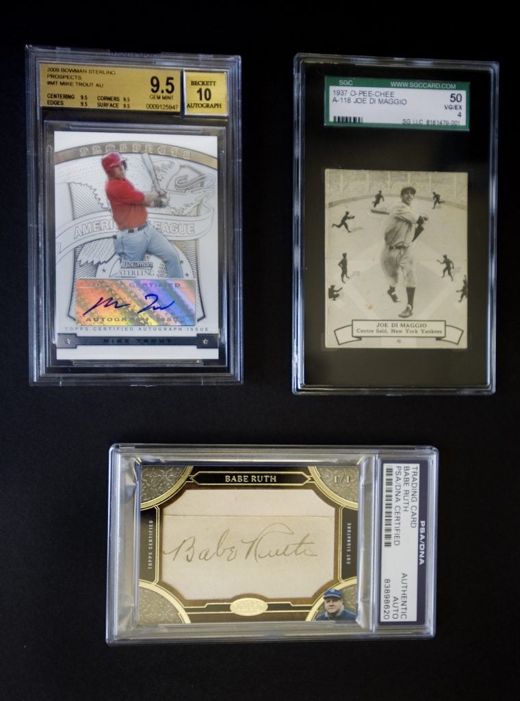 Rare collectable baseball cards, from top left: Mike Trout, Joe DiMaggio, and Babe Ruth. Photo by The Orange County Register/MediaNews Group via Getty Images. 
