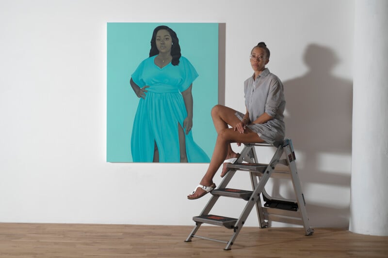 Amy Sherald in her studio with her portrait of Breonna Taylor (2020). Photo by Joseph Hyde courtesy of Hauser & Wirth.