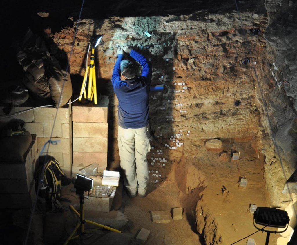 Ron Shaar taking samples for paleomagnestisim at Wonderwerk Cave. Photo courtesy of Michael Chazan.