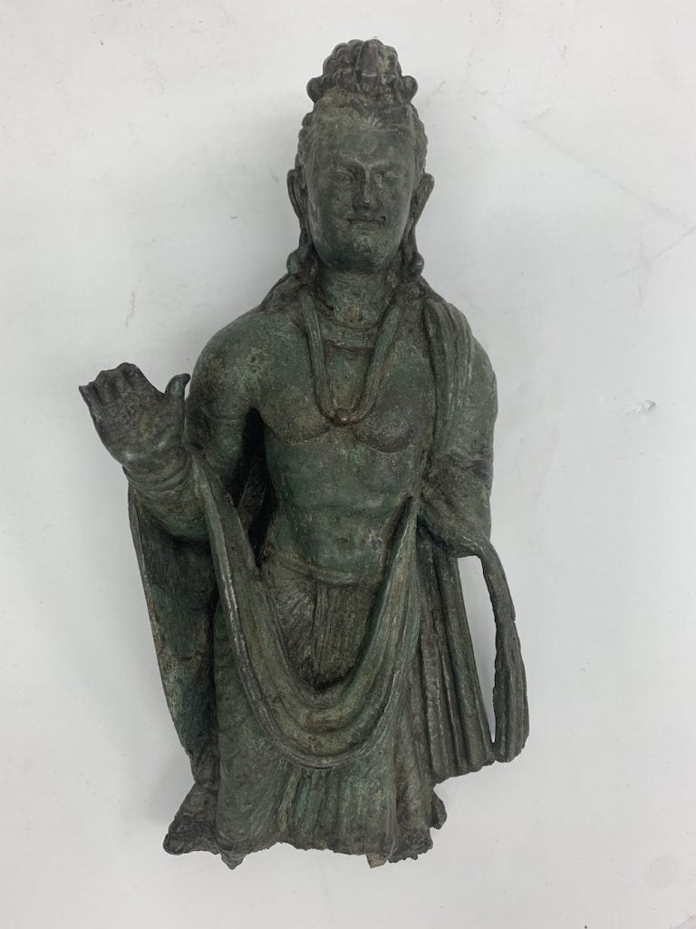 This bronze standing Buddha, dated to approximately the 3rd– 4th century C.E., was among the items that were returned. Image courtesy Manhattan District Attorney's Office.