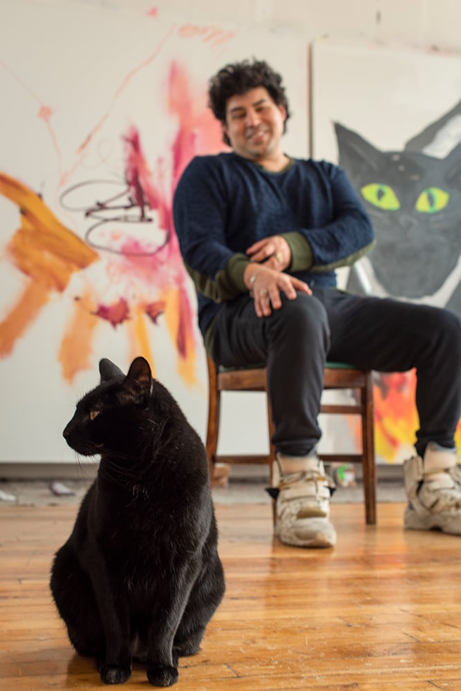 Robert Nava in his studio with Jumanji the cat. © Taylor Dafoe.