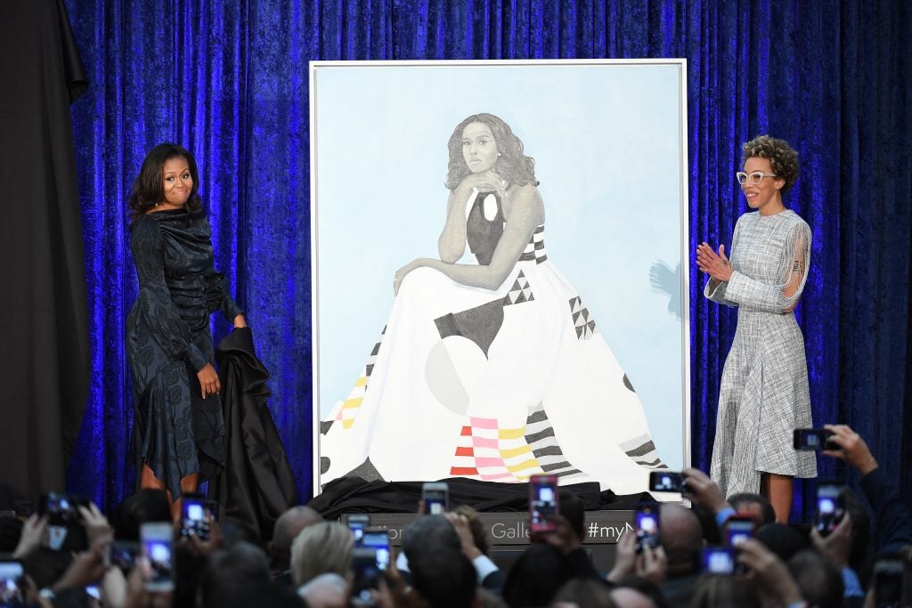 Former First Lady Michelle Obama and Amy Sherald unveil Obama's portrait at the Smithsonian National Portrait Gallery. Photo by Matt McClain/the <em>Washington Post</em> via Getty Images.