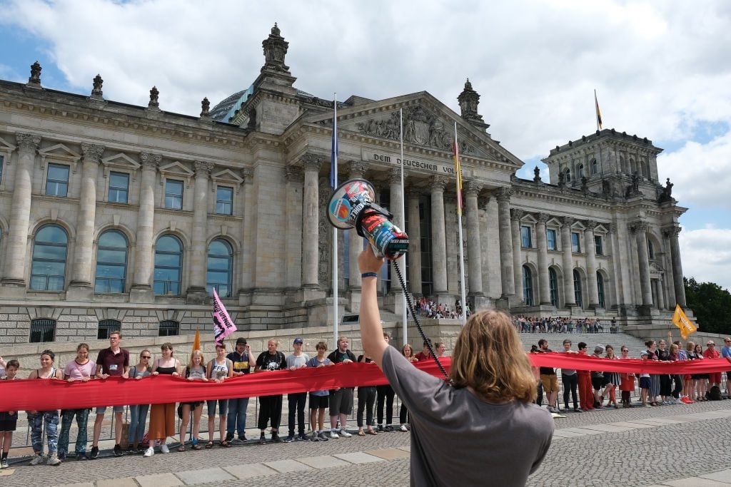 A climate change demonstration in front of the Reichstag in Berlin. Photo: Sean Gallup/Getty Images.