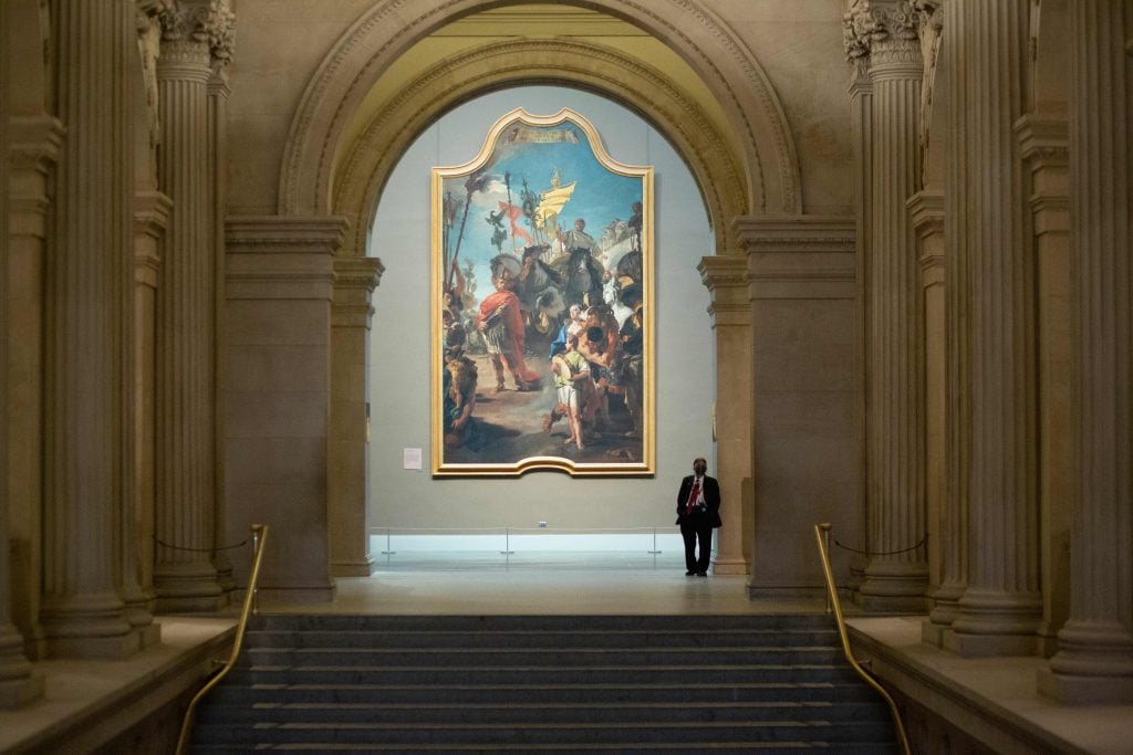 A security guard stands at his post as the Metropolitan Museum of Art in New York reopens to the public on August 29, 2020. Photo by Kena Betancur/AFP via Getty Images.