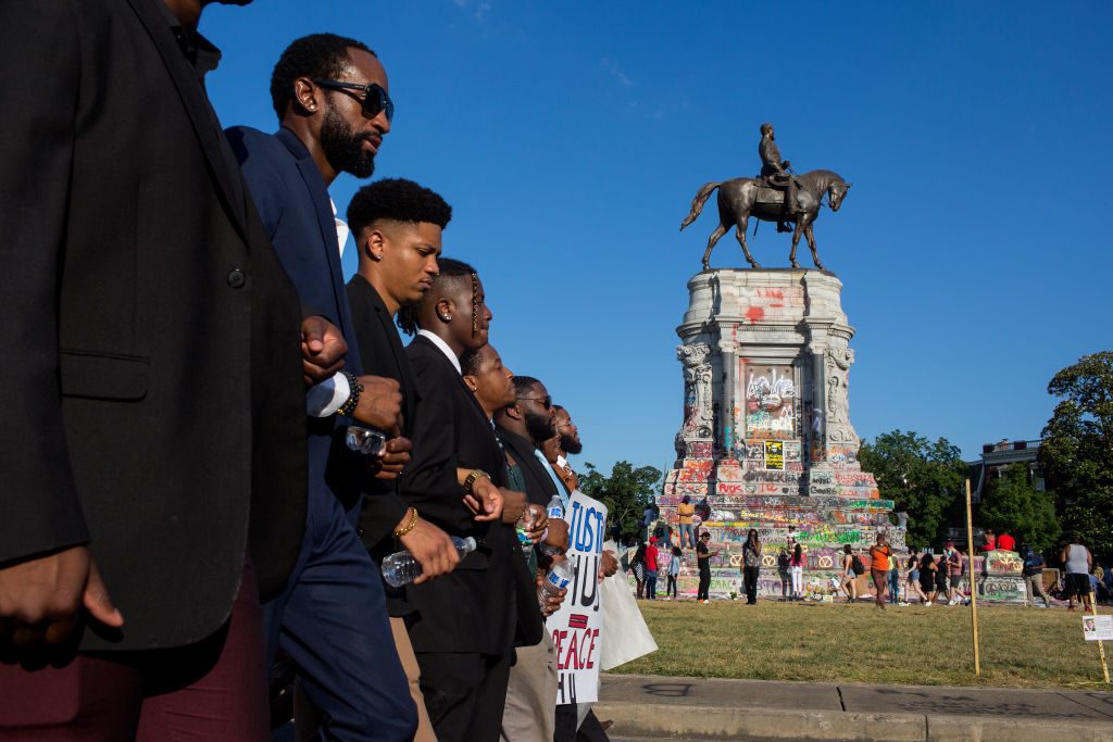 Black Lives Matter activists occupy the traffic circle underneath the statue of Confederate General Robert Lee on June 13, 2020 at Monument Avenue in Richmond, Virginia. Photo by Andrew Lichtenstein/Corbis via Getty Images.