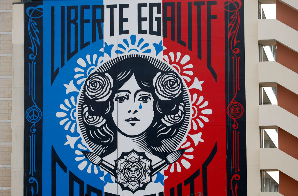 A giant fresco representing "Marianne" and the motto of France "Liberty, Equality, Fraternity" symbols of the French Republic, by US street artist Shepard Fairey aka OBEY. Photo by Chesnot/Getty Images.