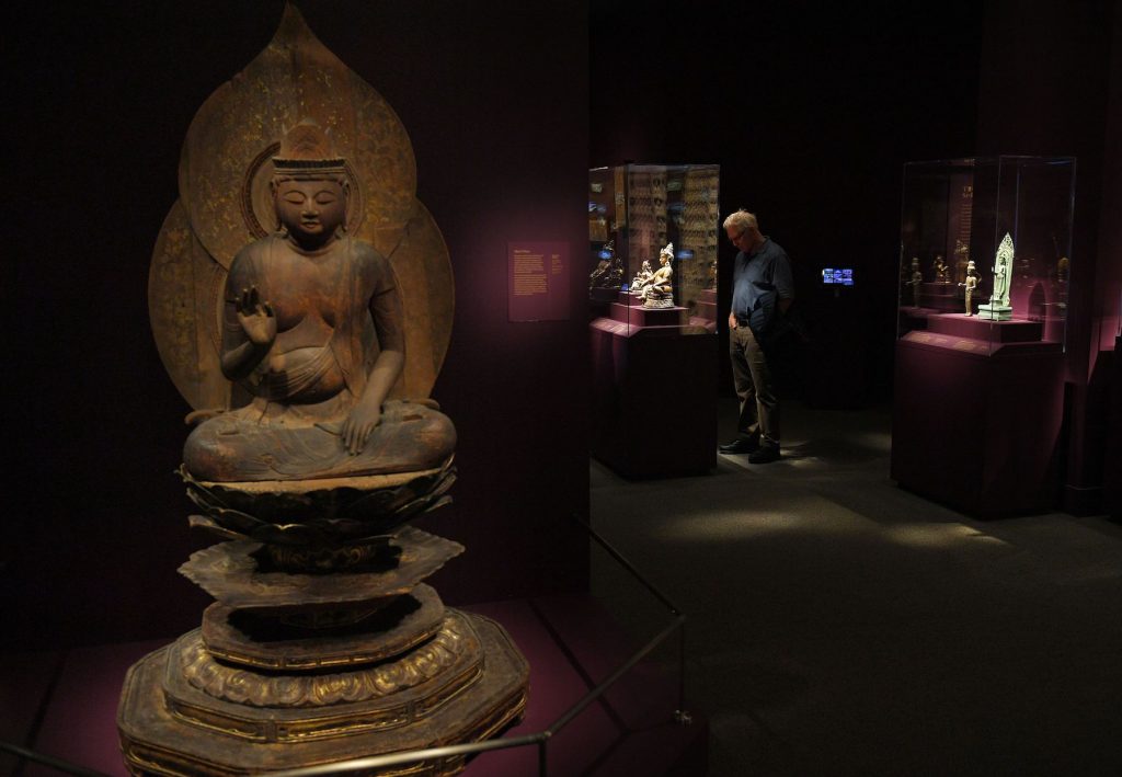 Visitors to the Arthur M. Sackler Gallery look at an exhibition on Buddhas in Washington, DC on March 26, 2019. - (Photo by Mandel Ngan/AFP via Getty Images)