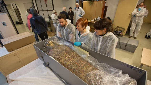 Experts at the Warsaw Mummy Project examining the world's first pregnant mummy. Photo courtesy of the Warsaw Mummy Project.