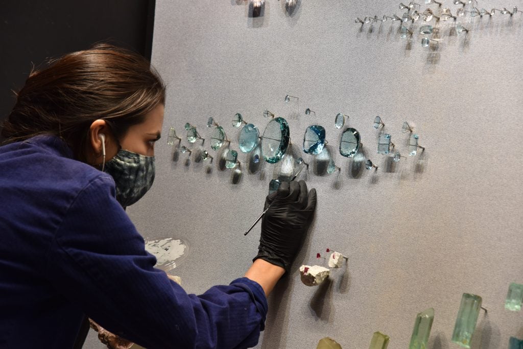 Exhibition staff members install specimens in the all-new Halls of Gems and Minerals at the American Museum of Natural History. Photo by D. Finnin, ©American Museum of Natural History.