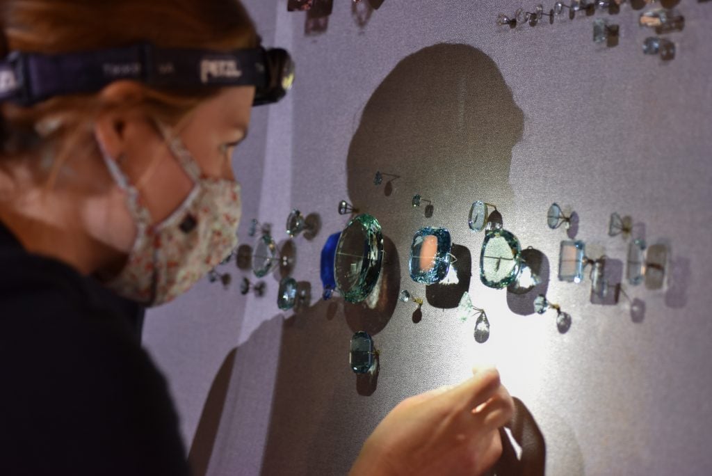 Exhibition staff members install specimens in the all-new Halls of Gems and Minerals at the American Museum of Natural History. Photo by D. Finnin, ©American Museum of Natural History.