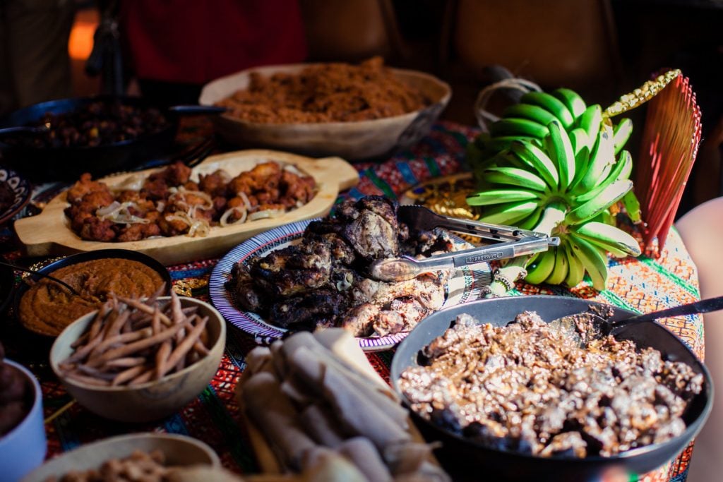 Traditional foods from countries including Ghana, Jamaica, Senegal, Uganda, and Eritrea at Yard Concept's first event, a party with African Chop House and the New Museum celebrating "We the People," Nari Ward's exhibition at the museum. Photo courtesy of Yard Concept. 