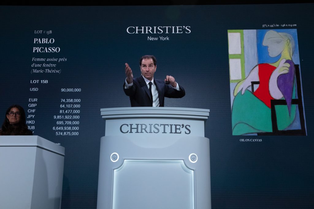 Auctioneer Adrien Meyer places bids during Christie's 20th Century evening auction in New York, May 2021.  Photo: Christie's Images Ltd.  2021