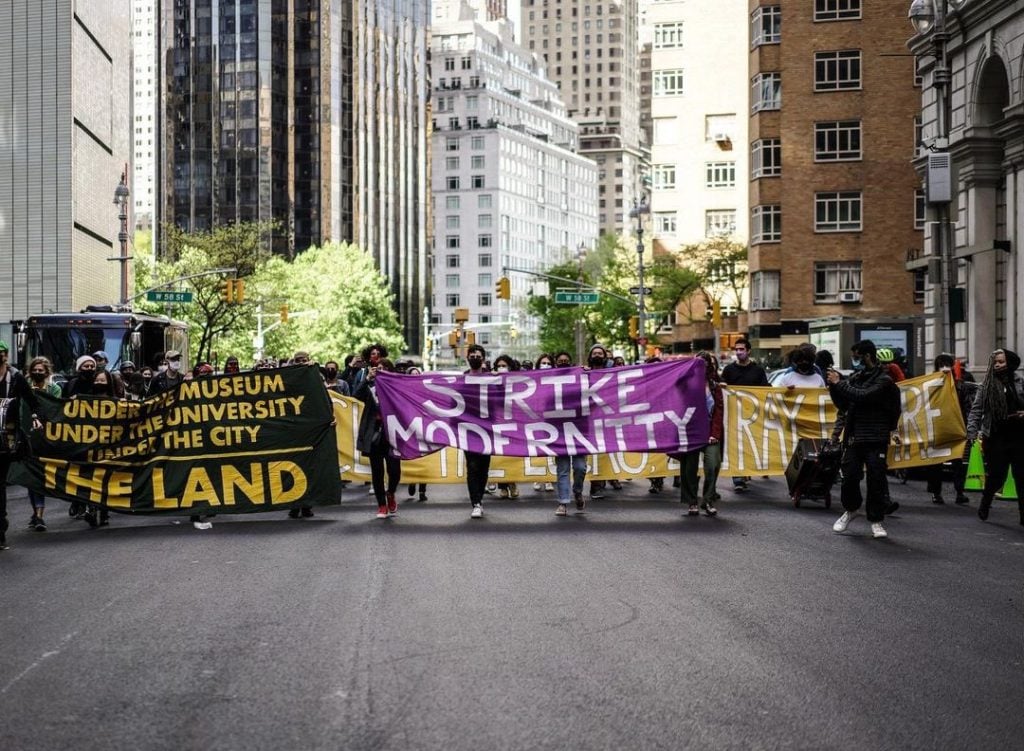 Strike MoMA demonstrators marching through midtown New York. Courtesy of Decolonize This Place via Twitter.