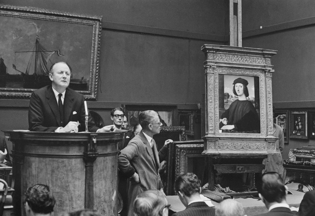 Sotheby's Chairman and chief auctioneer Peter Wilson (1913-1984) conducts a sale of Renaissance paintings at Sotheby's auction house in London on 28th November 1963. Photo by Les Lee/Daily Express/Hulton Archive/Getty Images.