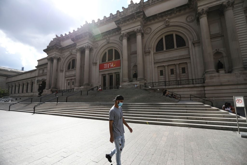 A pedestrian walks past the Metropolitan Museum of Art in New York, the United States, Aug. 18, 2020. Photo by Wang Ying/Xinhua via Getty images.