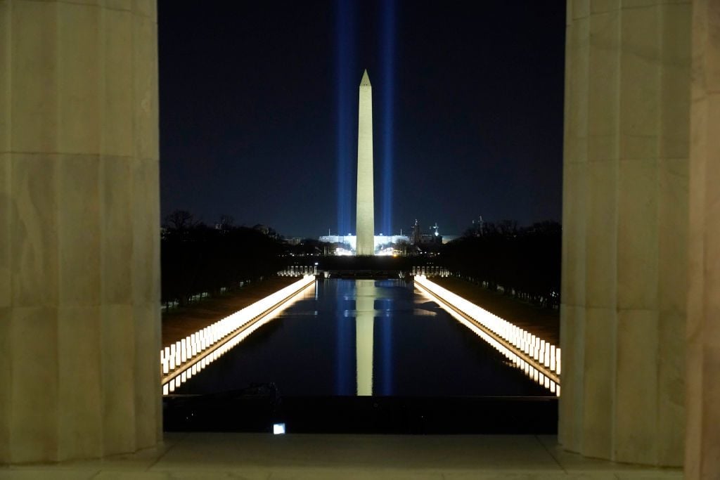 The Washington Monument is reflected in the Lincoln Memorial Reflecting Pool during a televised ceremony on January 20, 2021, the day of Biden's inauguration. Photo by Joshua Roberts-Pool/Getty Images.