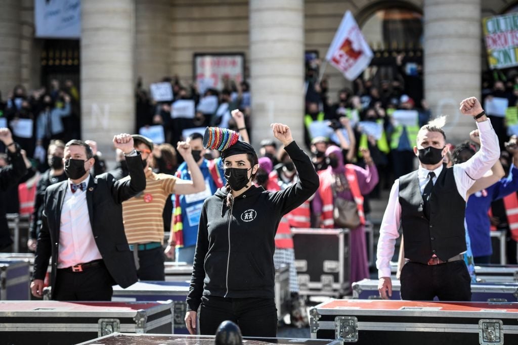 Protesters outside the occupied Odeon theatre against a reform of the unemployment insurance, in Paris on April 23, 2021. Photo: Stephane de Sakutin/AFP via Getty Images.