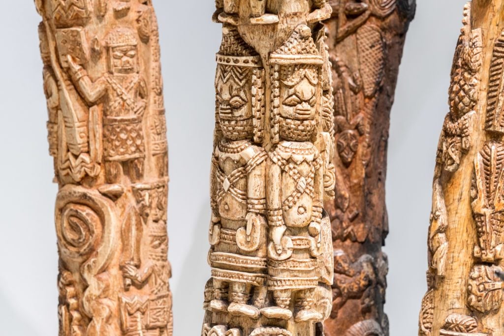 Carved elephant tusks looted by British soldiers from the Kingdom of Benin in 1897 are displayed in the "Where Is Africa" exhibition at the Linden Museum on May 05, 2021 in Stuttgart, Germany. Photo: Thomas Niedermueller/Getty Images.