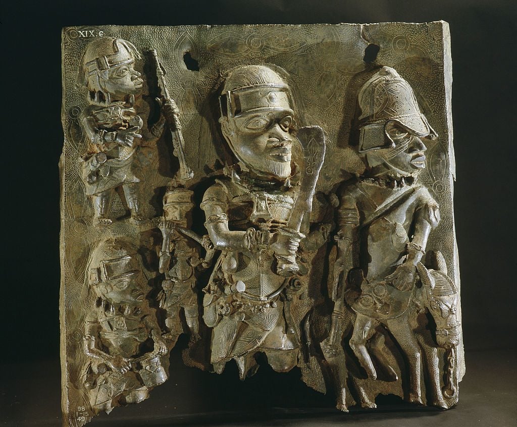 A plaque which decorated the palace of the Obas, Benin warriors are depicted in battle. Nigeria. Edo. Probably late 17th century. Benin City. (Photo by Werner Forman/Universal Images Group/Getty Images)
