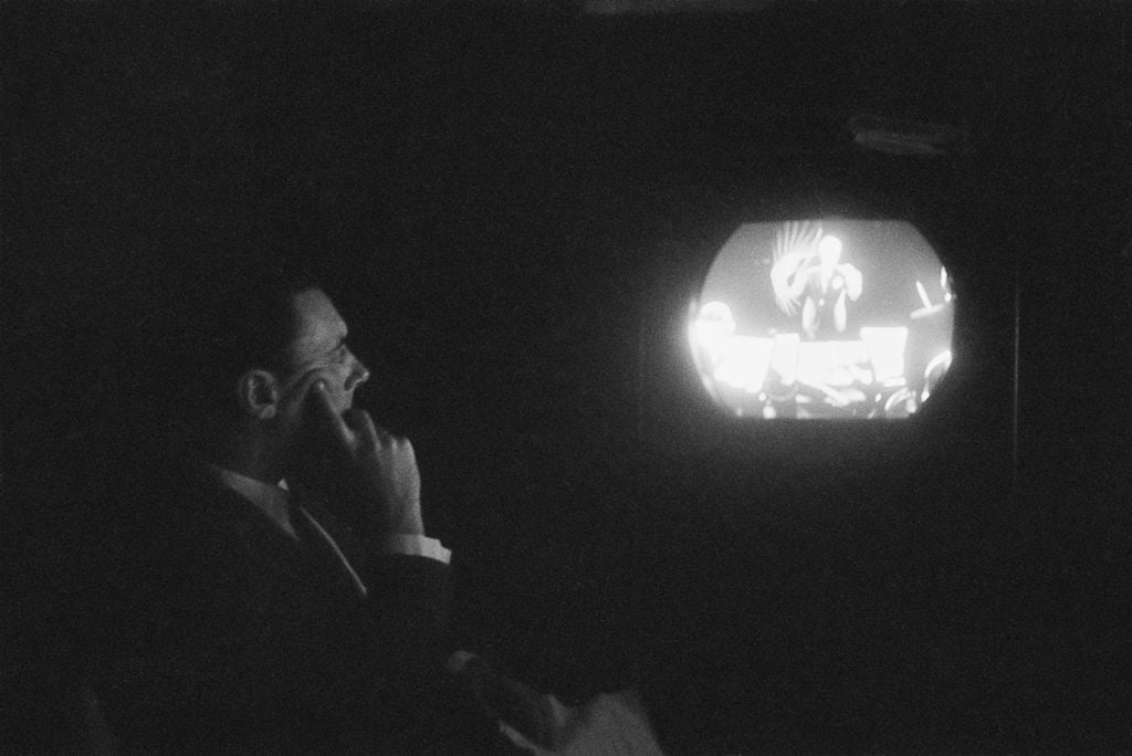 In a 2018 article on Garry WInogrand, Dyer writes of one photograph that "the abundance of information is matched always by the amount withheld. In spite—and because — of everything that’s going on, it’s impossible to tell what’s going on." Winogrand took the above picture of British TV executive Ronnie Waldman in 1953. Photo by Garry Winogrand/Picture Post/Hulton Archive/Getty Images.